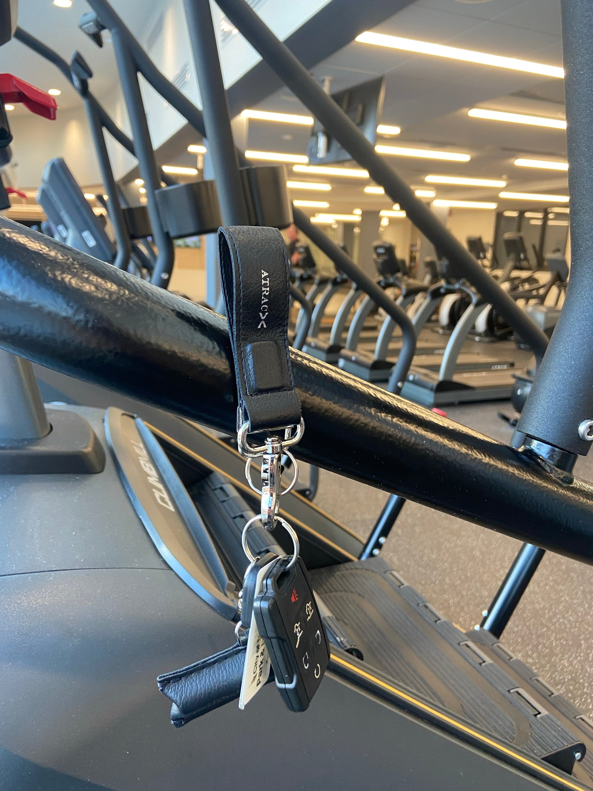 A black vegan leather Keychain Bracelet in gym
